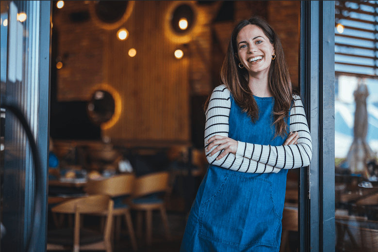Woman standing in doorway smiling